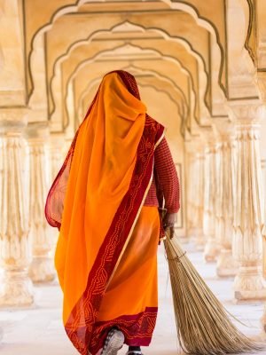 rear-view-of-woman-wearing-orange-sari-using-broom-2025-04-03-03-44-25-utc-scaled.jpg