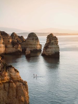 sunrise-view-of-ponta-da-piedade-with-stand-up-pad-2MRDCMT.jpg